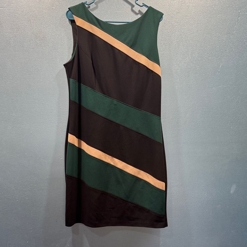 Brand new never worn size 14 green, tan and black dress. Very shape flattering .